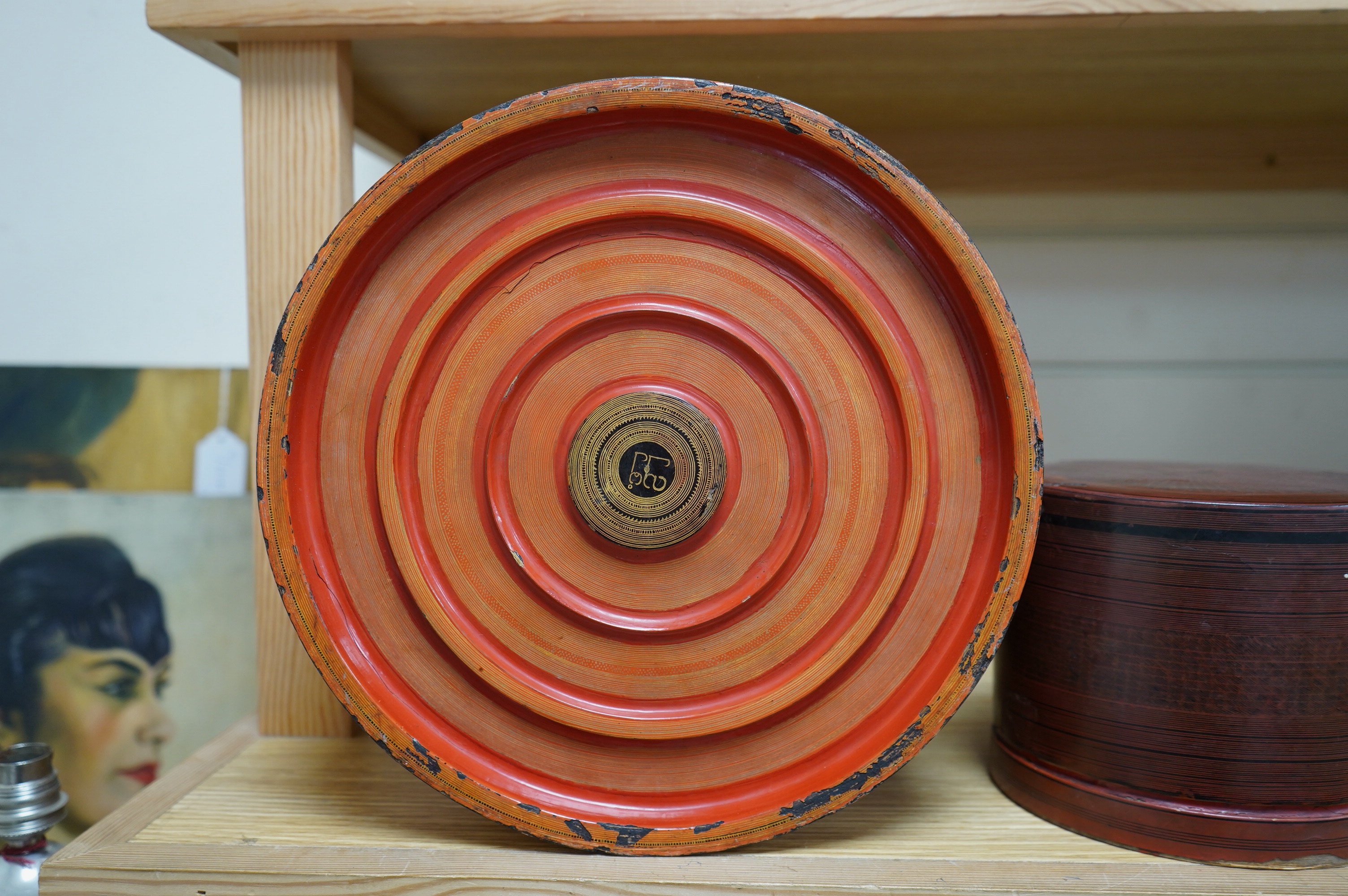 Two 19th century Burmese lacquered cylindrical boxes, largest 27cm in diameter. Condition - poor